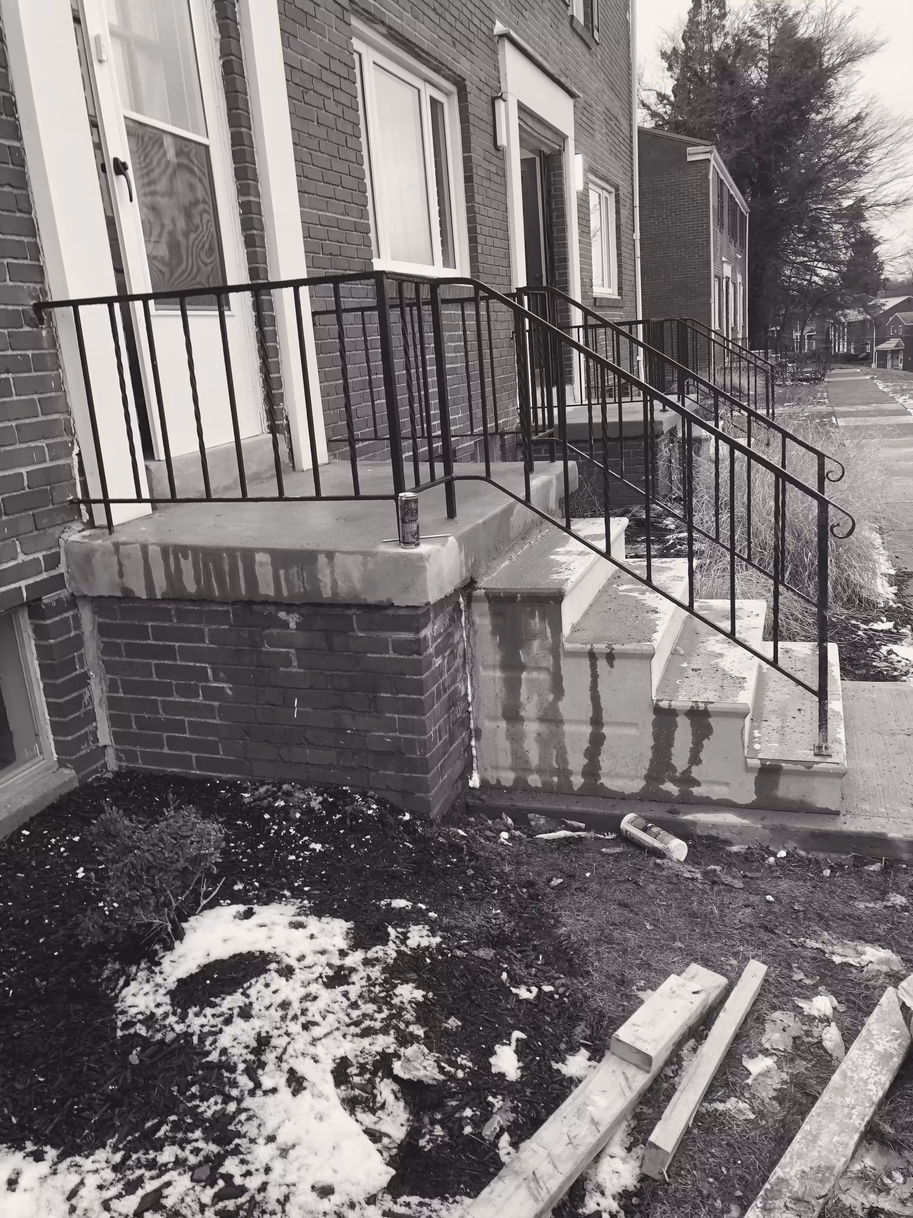 Concrete · stoop restoration · brick row (a)