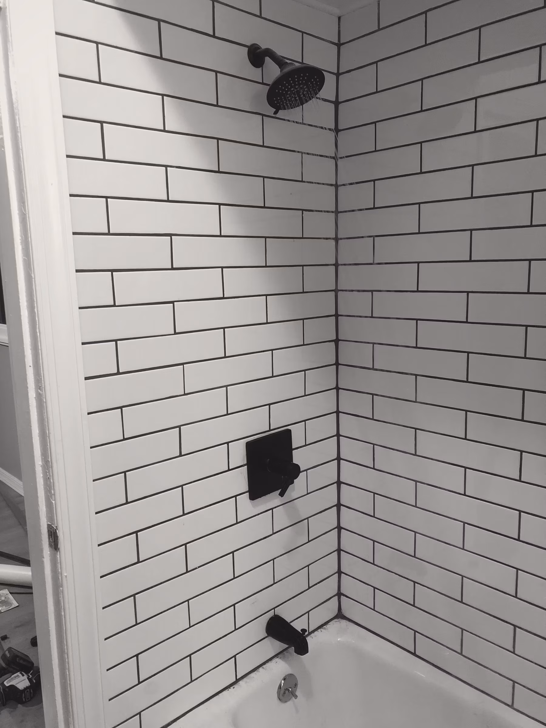 Tile · subway shower · running bond, dark joint