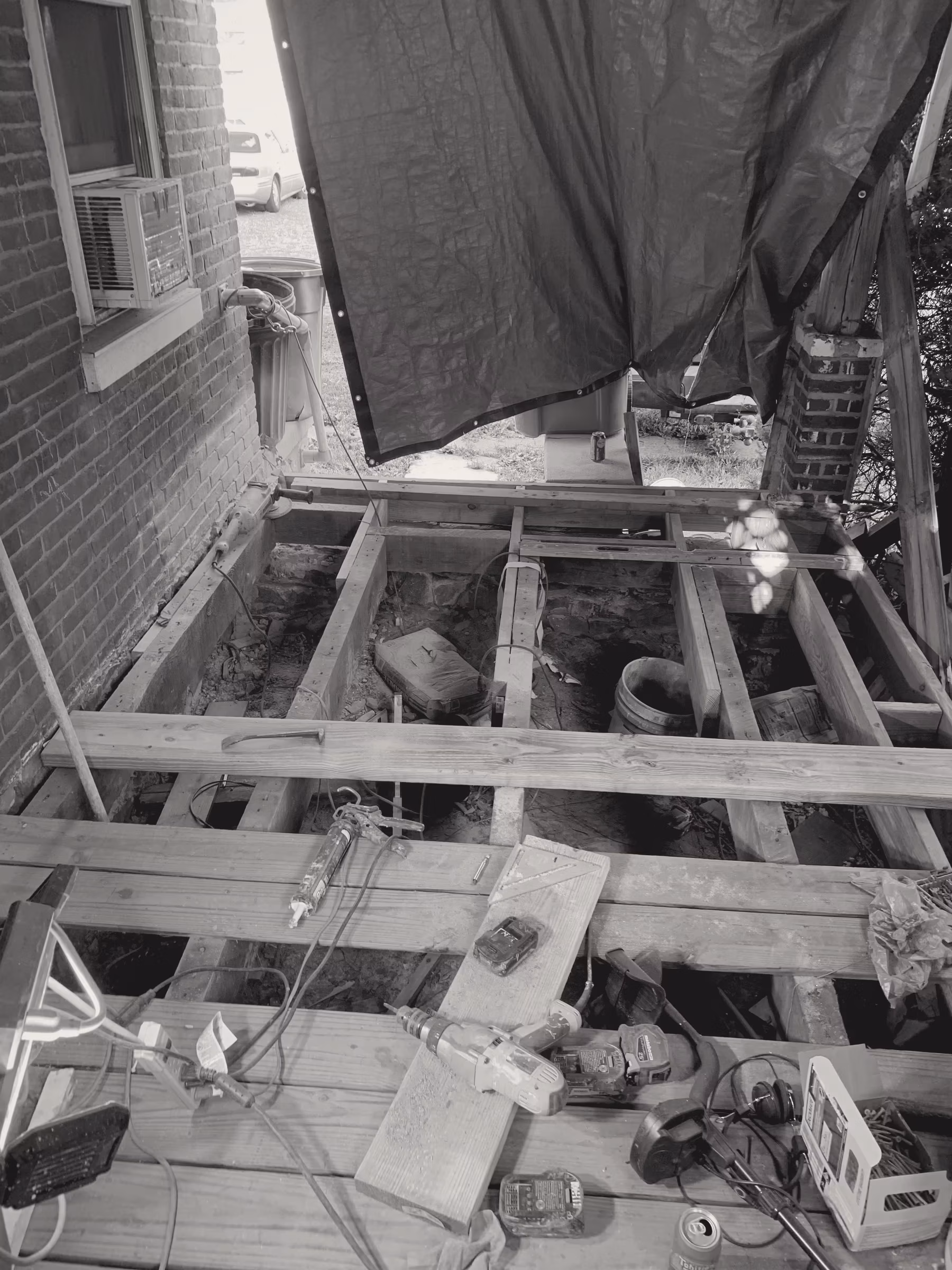 Demo · rear porch · deck removed to joists