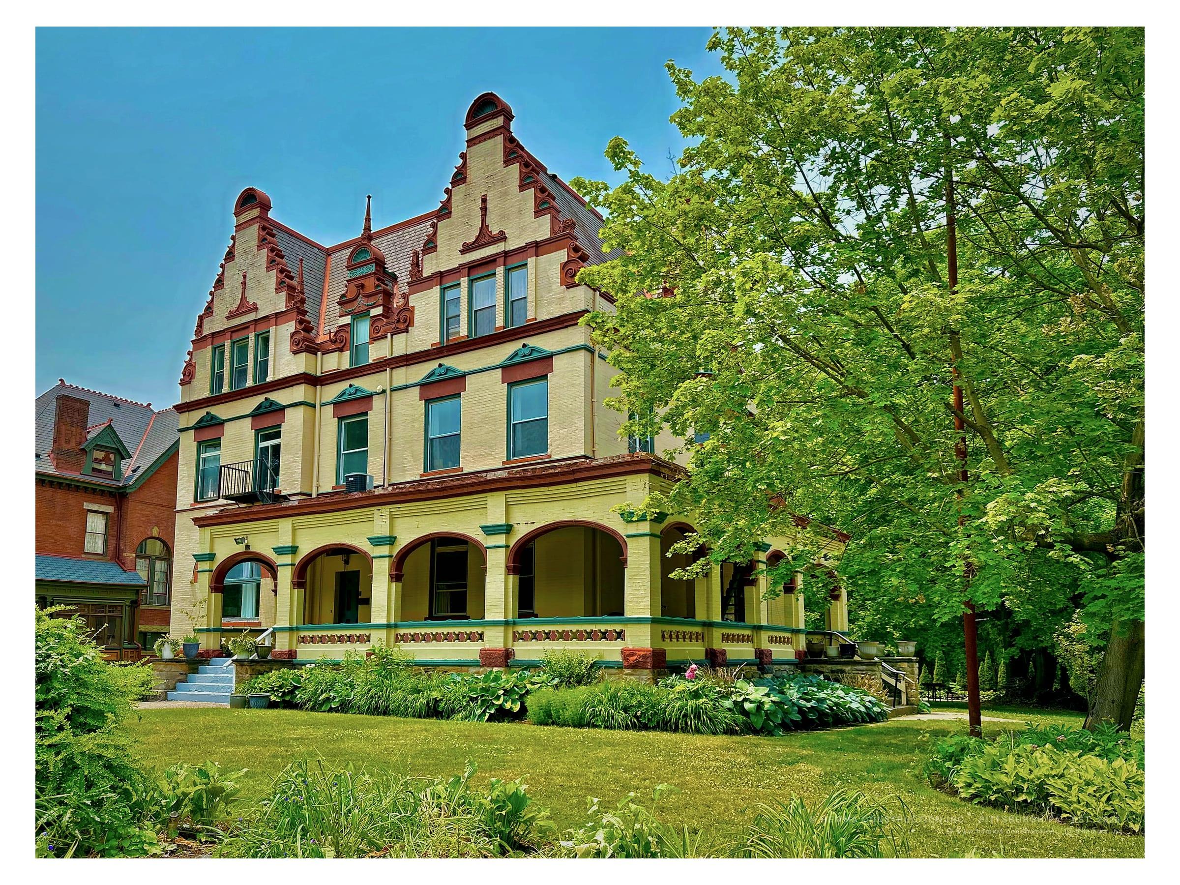 Highland Park residence exterior — stone and brick Queen Anne facade with original bargeboard