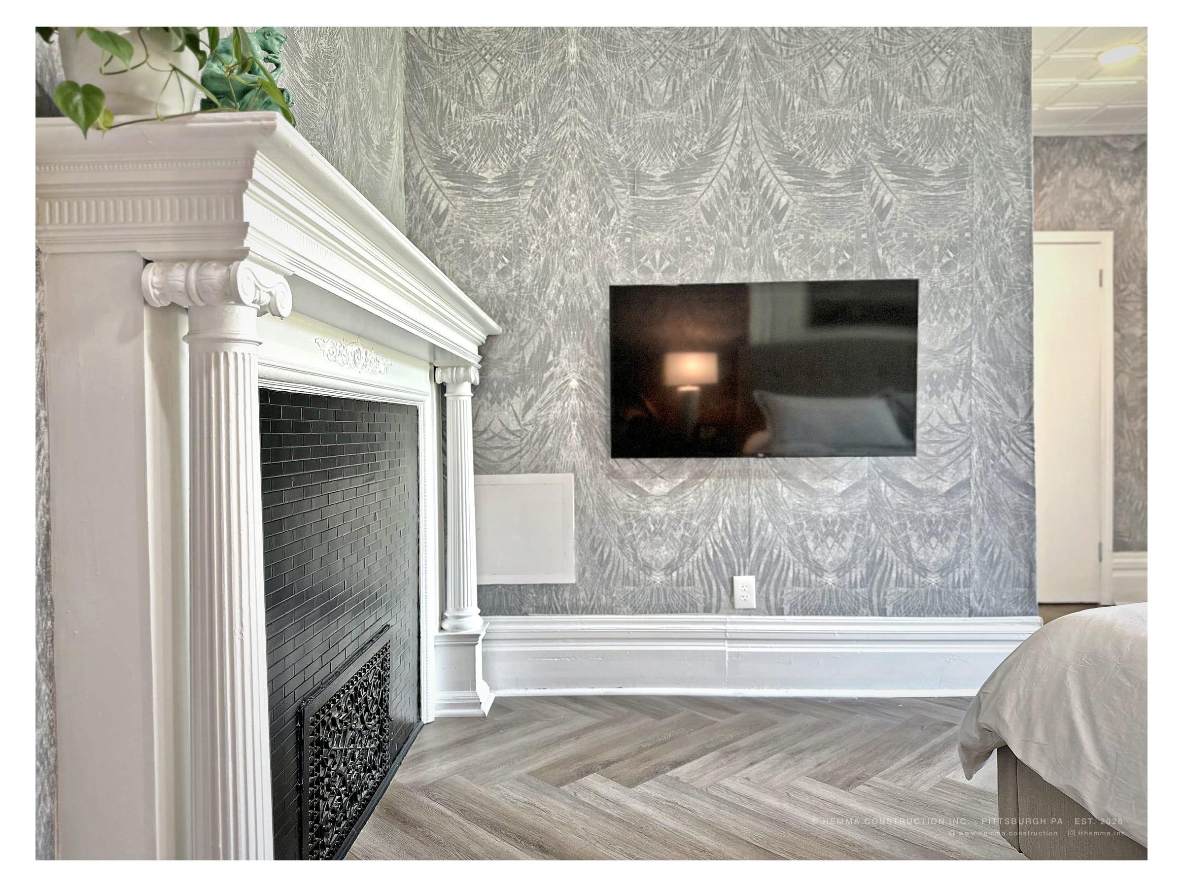 Primary bedroom fireplace wall with original millwork