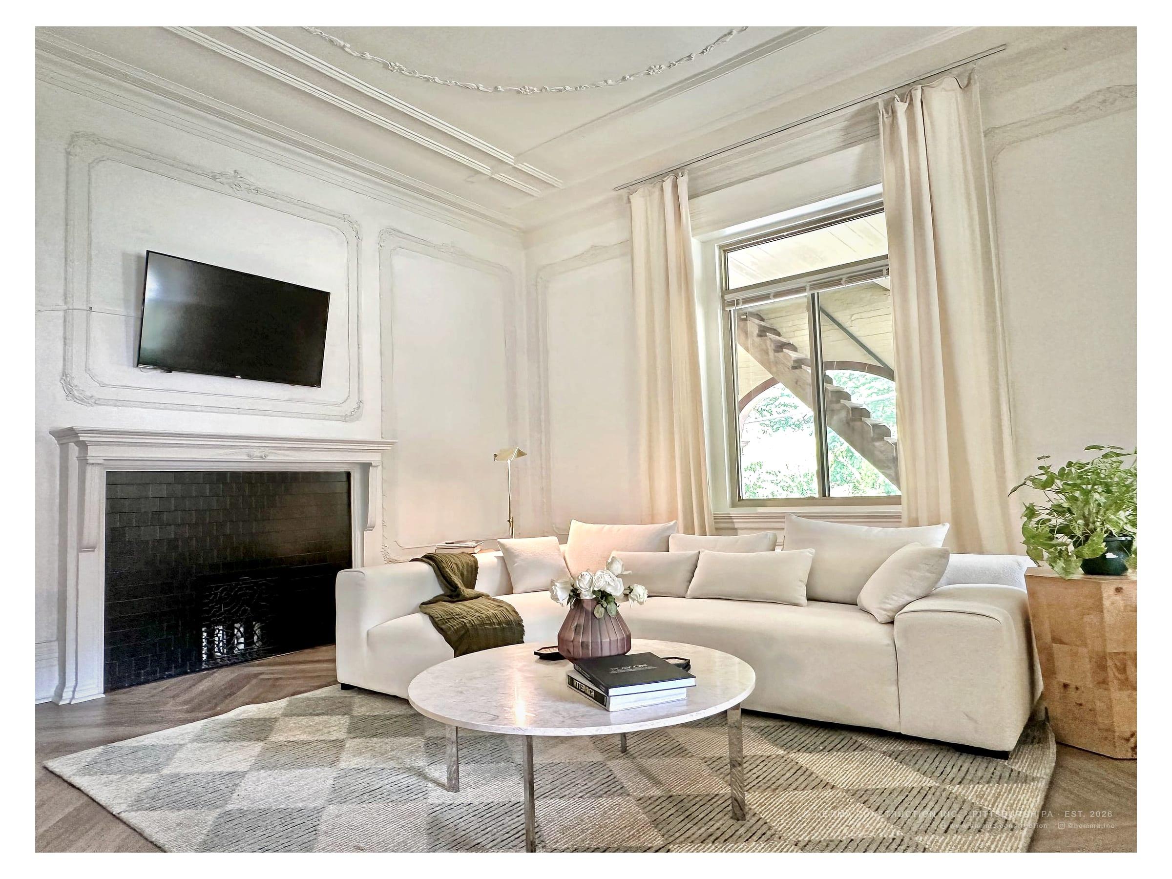 Living room, white sectional and marble coffee table