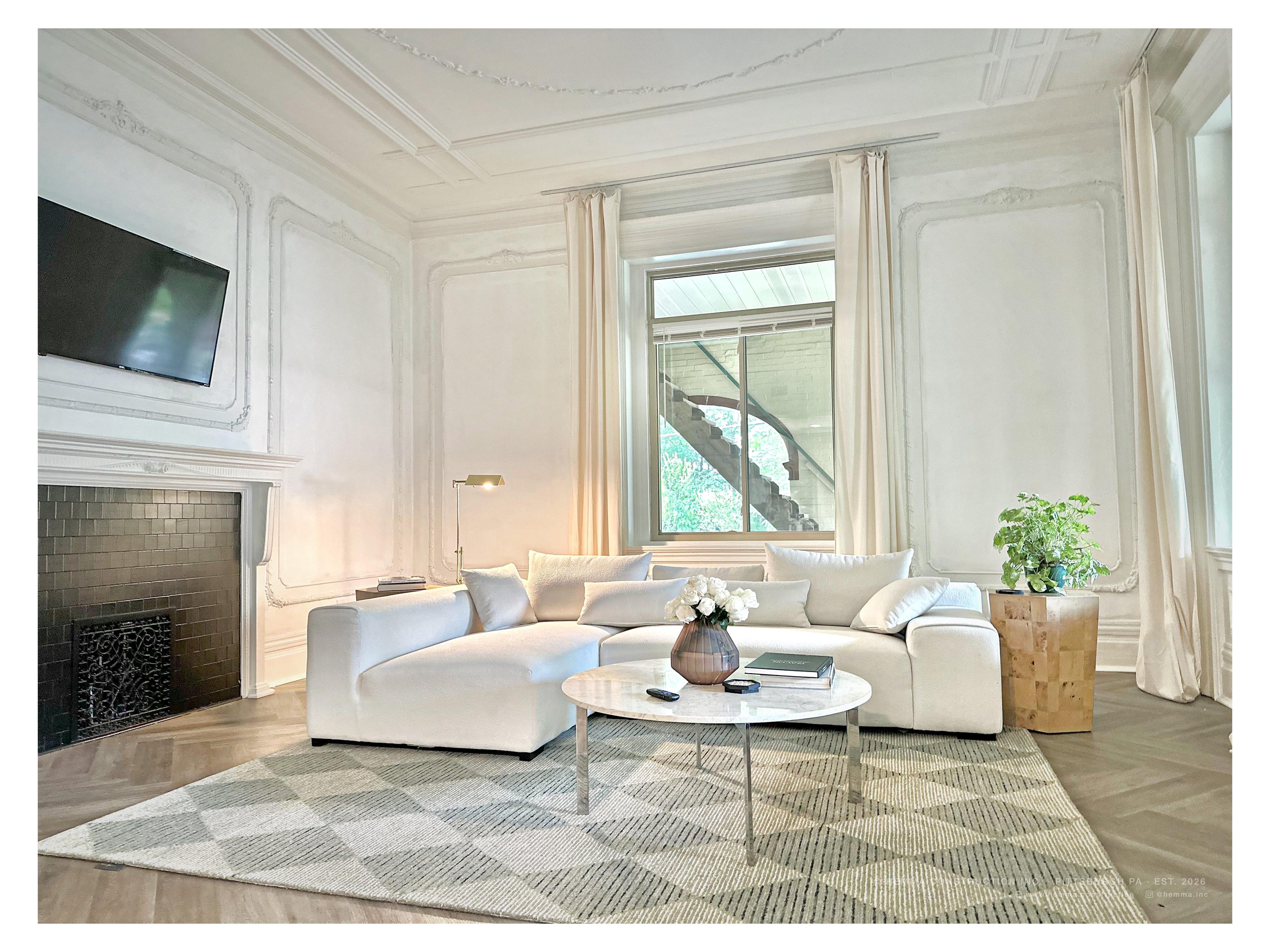 Living room, white sectional, original ornamental plaster ceiling