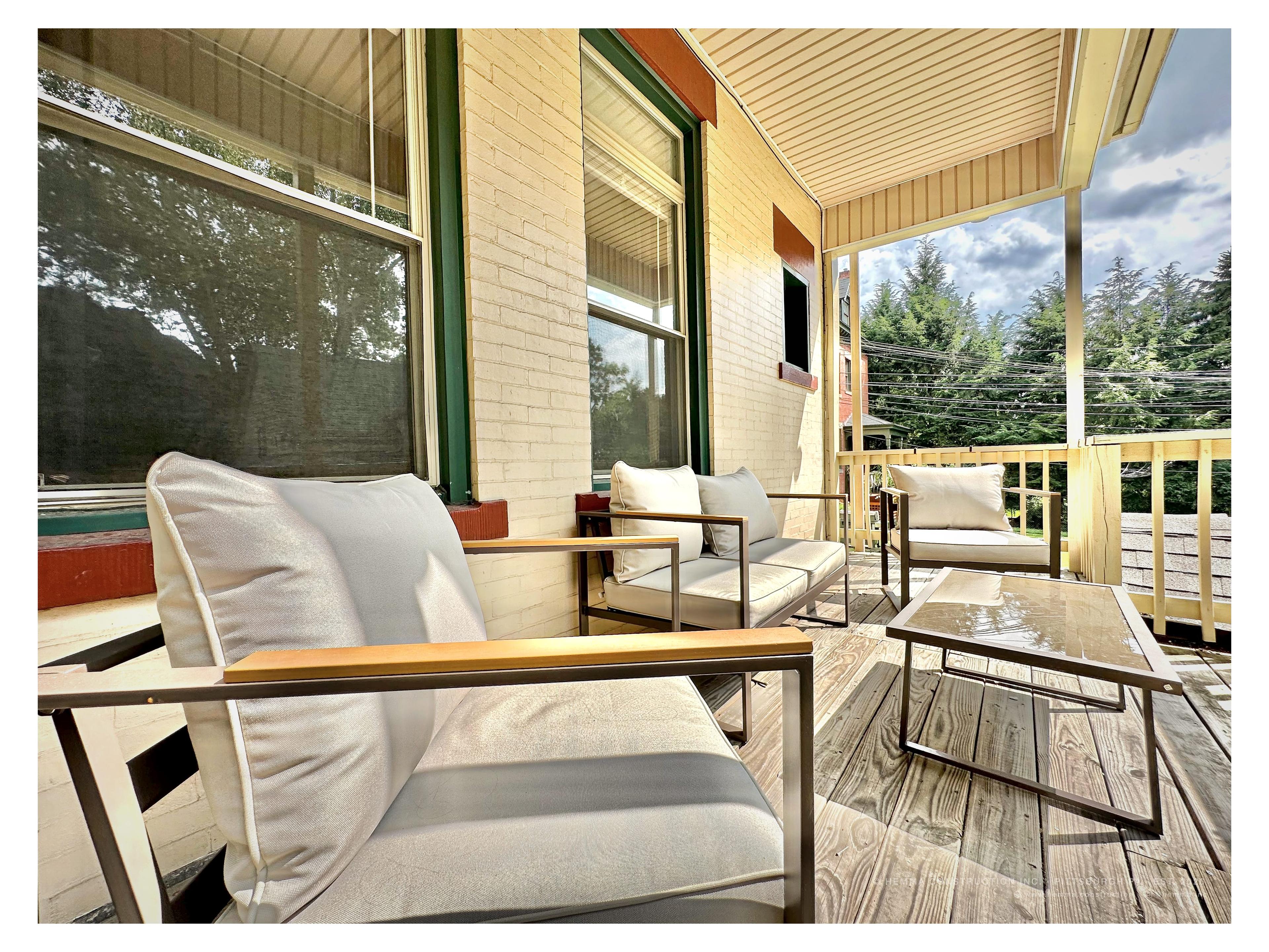 Side porch — modern outdoor seating, garden elevation view