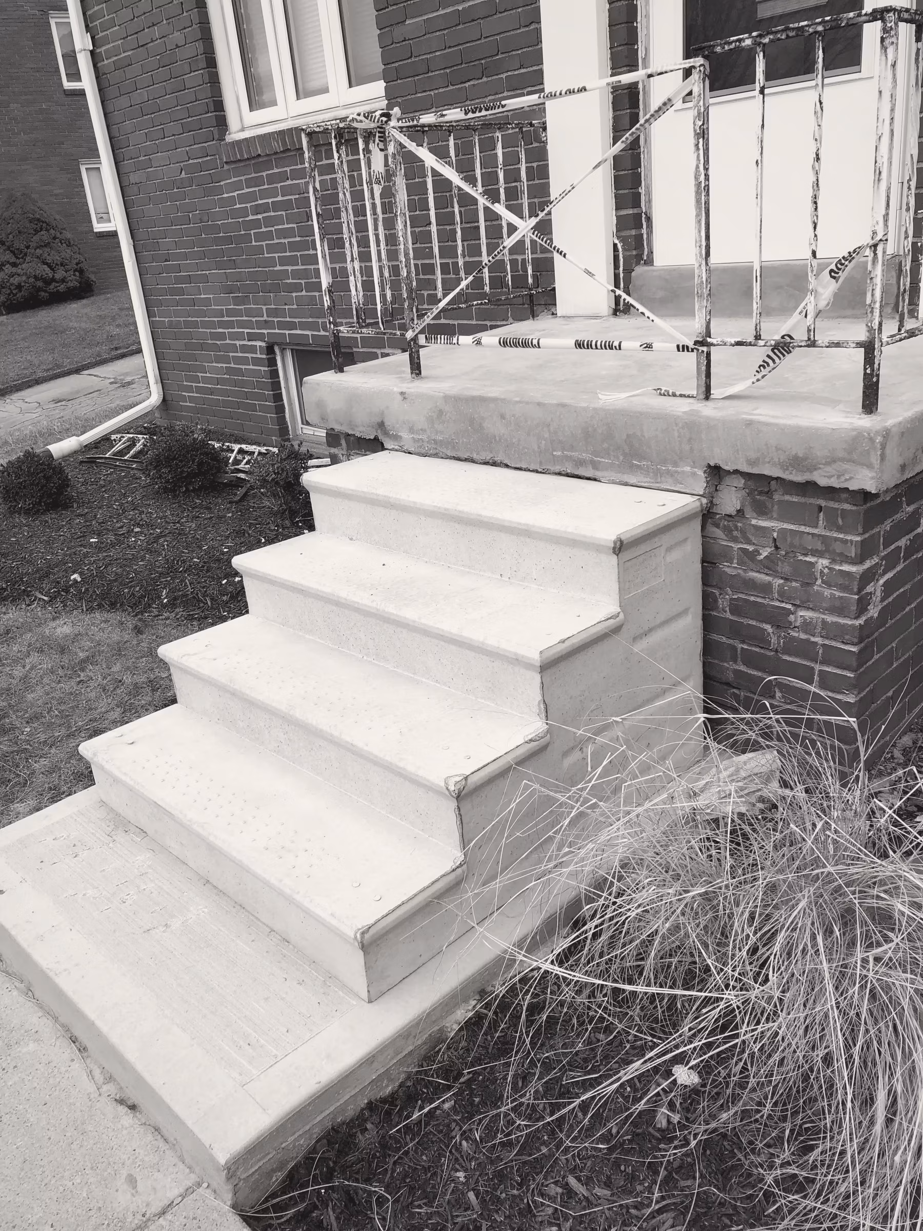Concrete · stoop · new pour at existing brick base